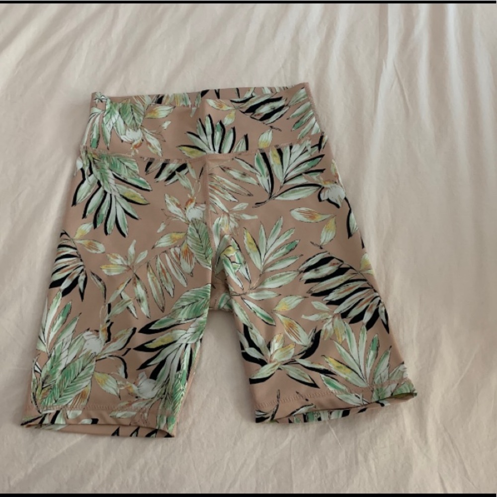 Pink with leave pattern biker shorts.